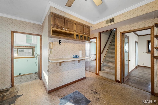 135 Oak Tree Dr, Webster Groves, MO 63119 - kitchen featuring wallpapered walls, crown molding, open shelves, brown cabinets, and a ceiling fan
