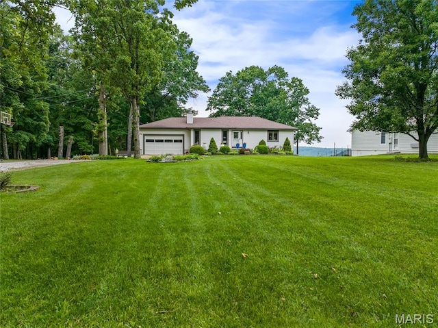 1171 Thunder Mountain Rd, Camdenton, MO 65020 - single story home with an attached garage, a front lawn, and a chimney