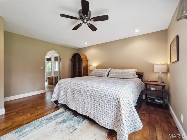 1171 Thunder Mountain Rd, Camdenton, MO 65020 - bedroom with arched walkways, wood finished floors, a ceiling fan, and recessed lighting
