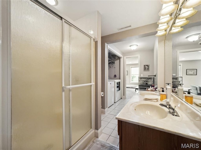 1171 Thunder Mountain Rd, Camdenton, MO 65020 - full bathroom with vanity, a shower stall, washer and clothes dryer, tile patterned flooring, and a chandelier
