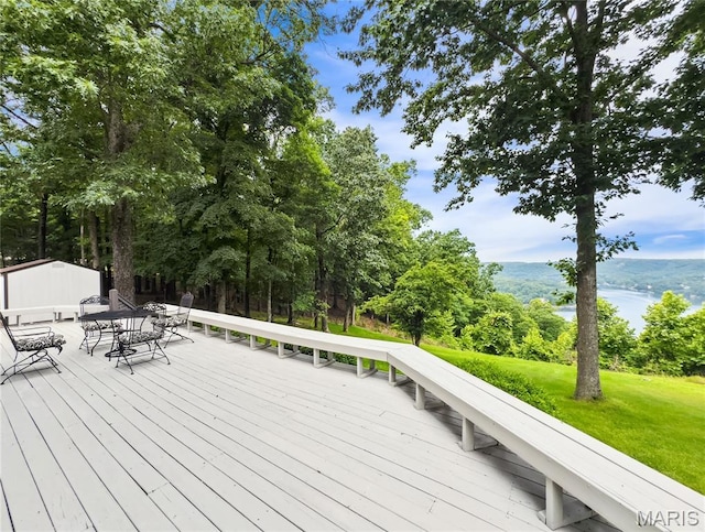 1171 Thunder Mountain Rd, Camdenton, MO 65020 - wooden deck with outdoor dining area, a yard, and a water view