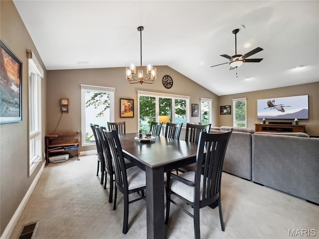 1171 Thunder Mountain Rd, Camdenton, MO 65020 - dining room with light carpet, vaulted ceiling, ceiling fan, and a chandelier