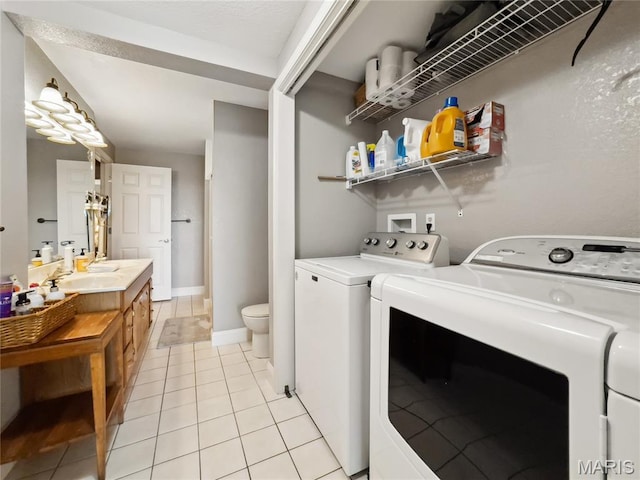 1171 Thunder Mountain Rd, Camdenton, MO 65020 - laundry room with washing machine and dryer and light tile patterned floors
