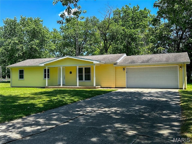 410 N Cleveland St, Fillmore, IL 62032 - single story home featuring an attached garage, covered porch, driveway, and a front yard