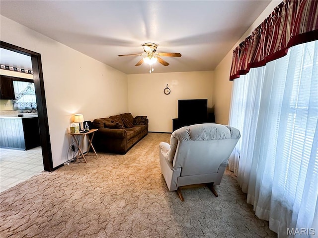 410 N Cleveland St, Fillmore, IL 62032 - living area with ceiling fan and light colored carpet