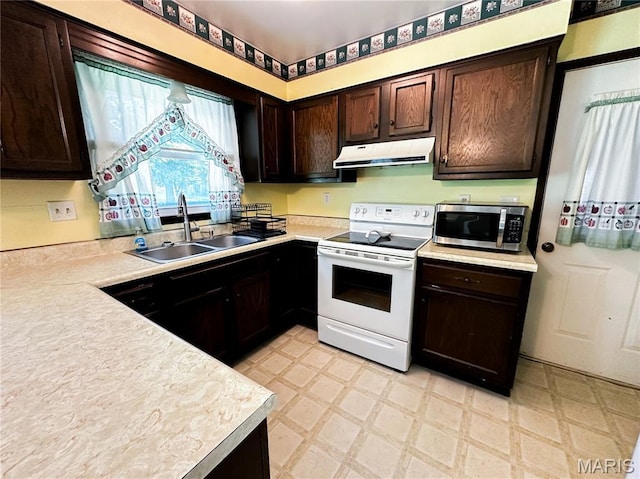 410 N Cleveland St, Fillmore, IL 62032 - kitchen with electric stove, stainless steel microwave, under cabinet range hood, light flooring, and light countertops