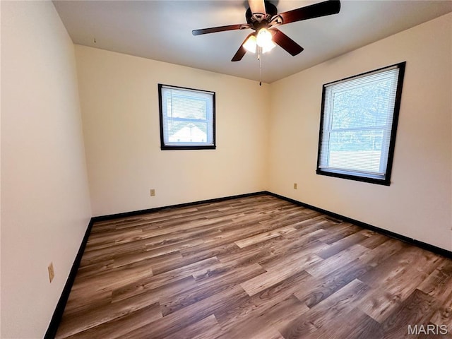 410 N Cleveland St, Fillmore, IL 62032 - empty room with wood finished floors and a ceiling fan