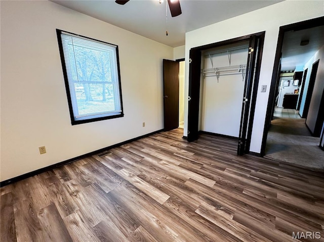 410 N Cleveland St, Fillmore, IL 62032 - unfurnished bedroom with wood finished floors, a closet, and ceiling fan