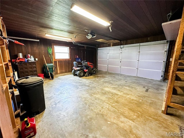 410 N Cleveland St, Fillmore, IL 62032 - garage featuring a garage door opener, wooden walls, and wooden ceiling