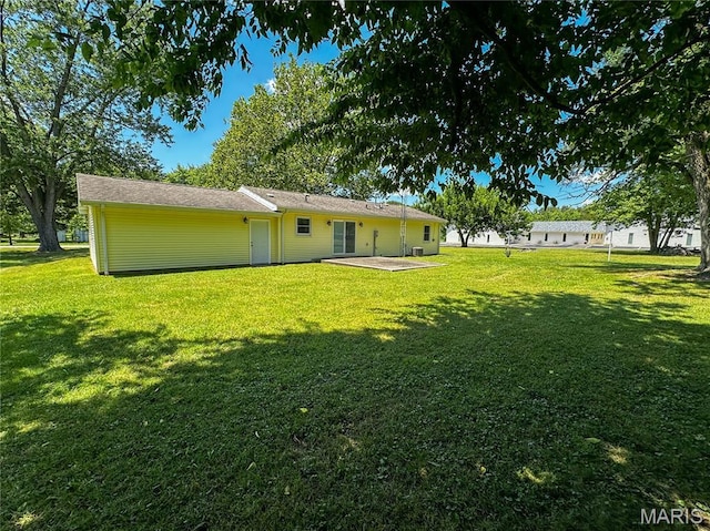 410 N Cleveland St, Fillmore, IL 62032 - rear view of property featuring a lawn and a patio