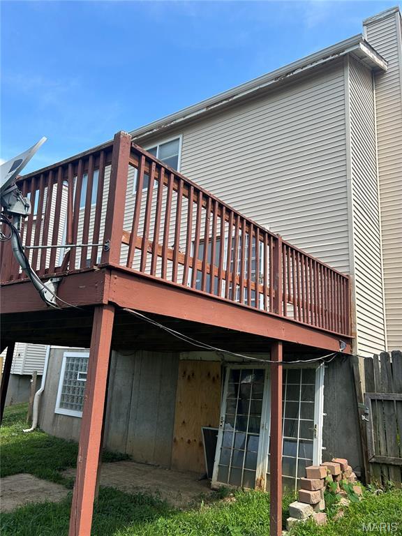 12922 High Crest St, Black Jack, MO 63033 - rear view of property with a wooden deck