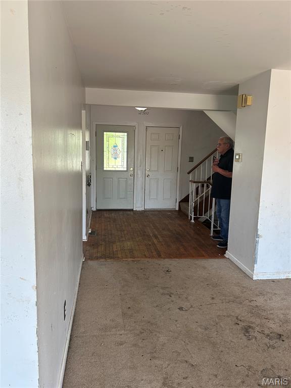 12922 High Crest St, Black Jack, MO 63033 - carpeted entryway with baseboards and stairs