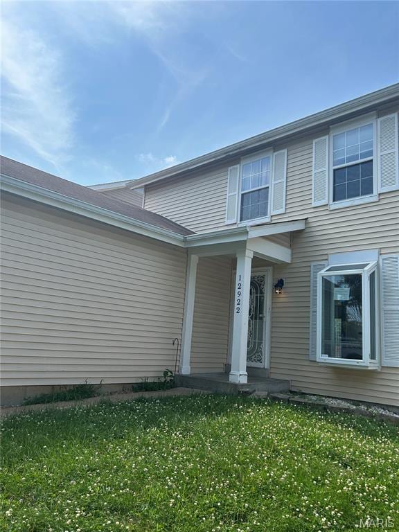 12922 High Crest St, Black Jack, MO 63033 - property entrance with a yard