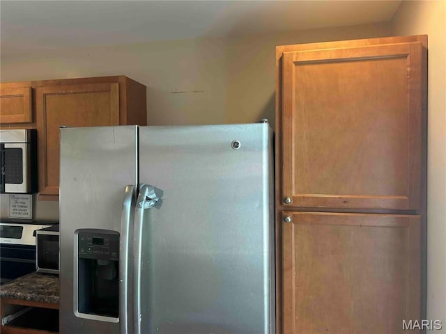 12922 High Crest St, Black Jack, MO 63033 - kitchen with appliances with stainless steel finishes and brown cabinets