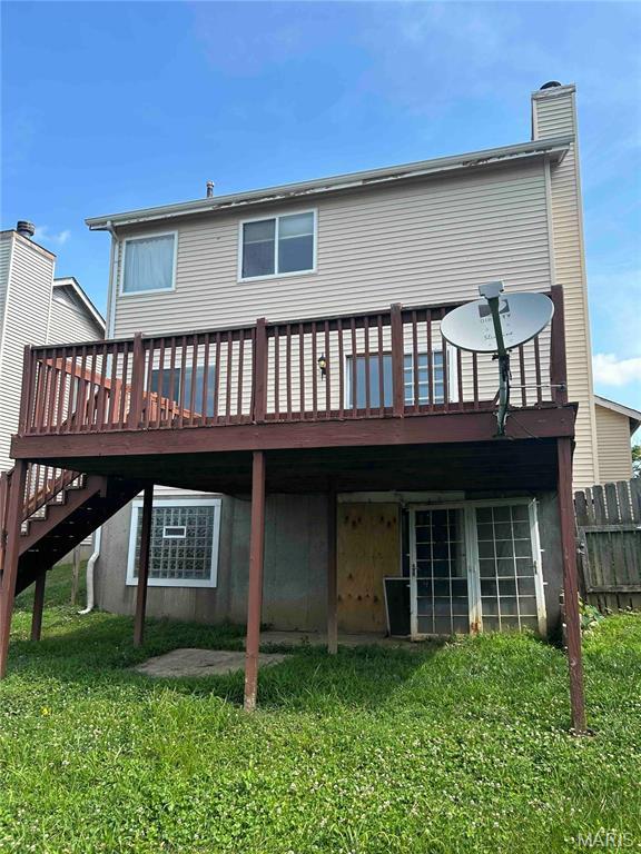 12922 High Crest St, Black Jack, MO 63033 - back of house featuring a deck, a chimney, and stairs