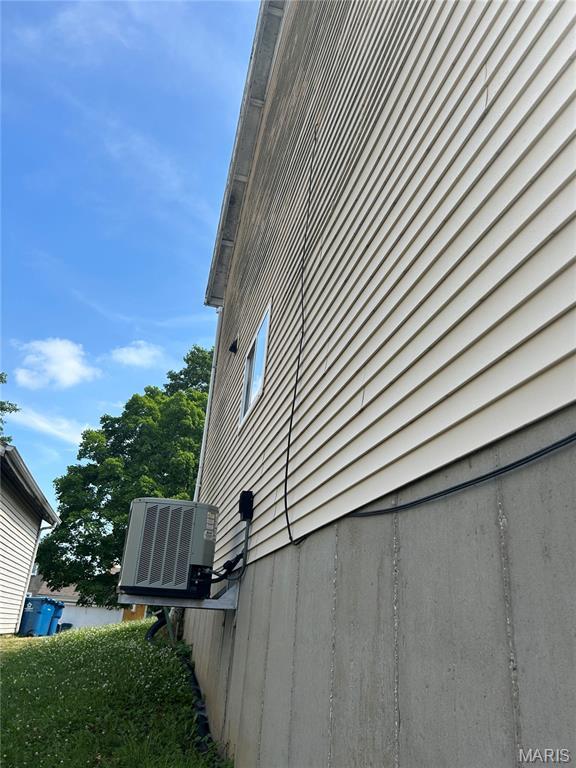 12922 High Crest St, Black Jack, MO 63033 - view of side of home with a central AC unit