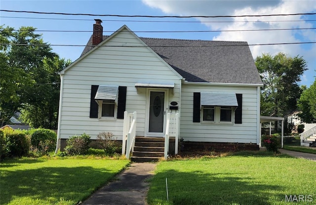 934 Raines Ave, Jackson, MO 63755 - bungalow-style house featuring a front lawn, roof with shingles, and a chimney