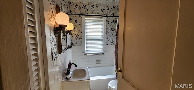 934 Raines Ave, Jackson, MO 63755 - full bath featuring wallpapered walls, a bathtub, wainscoting, vanity, and tile walls