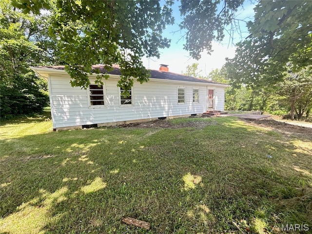 1203 N Main St, Salem, MO 65560 - back of house with a lawn and a chimney