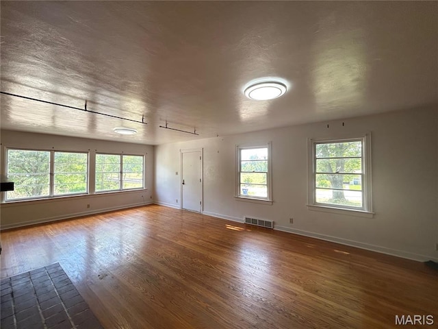 1203 N Main St, Salem, MO 65560 - empty room with wood finished floors and baseboards