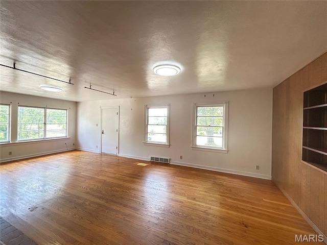 1203 N Main St, Salem, MO 65560 - unfurnished room featuring healthy amount of natural light and wood finished floors
