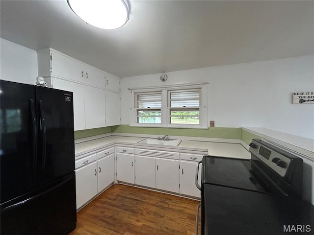1203 N Main St, Salem, MO 65560 - kitchen featuring freestanding refrigerator, electric range oven, light countertops, and white cabinets