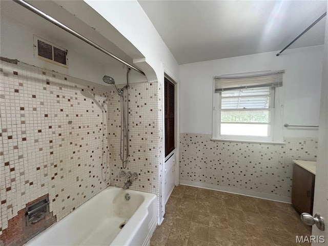 1203 N Main St, Salem, MO 65560 - full bathroom with bathing tub / shower combination, vanity, a wainscoted wall, and tile walls