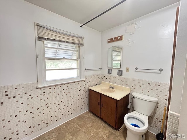 1203 N Main St, Salem, MO 65560 - bathroom featuring tile walls, vanity, wainscoting, and tile patterned flooring