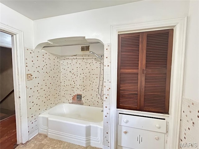 1203 N Main St, Salem, MO 65560 - bathroom with bathtub / shower combination and tile patterned flooring