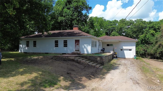 1203 N Main St, Salem, MO 65560 - view of front of property with an attached garage, driveway, a chimney, and a front yard