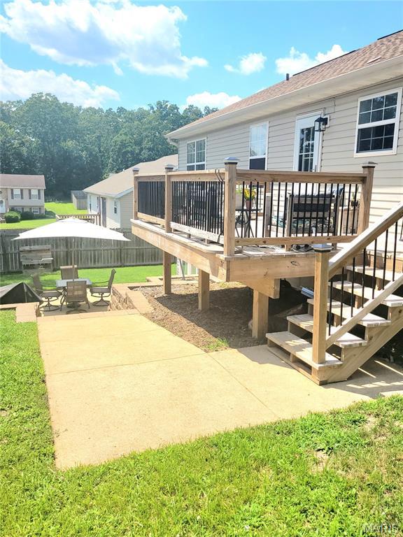346 Cartpath Ln, Saint Clair, MO 63077 - back of house featuring a wooden deck, a patio area, a yard, and roof with shingles