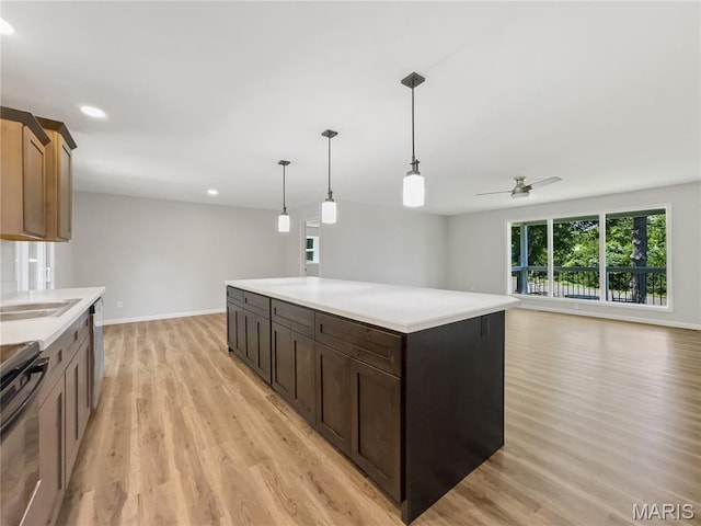326 State Highway W Rd, Macks Creek, MO 65786 - kitchen featuring light wood-style flooring, light countertops, a ceiling fan, hanging light fixtures, and recessed lighting