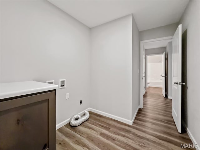 326 State Highway W Rd, Macks Creek, MO 65786 - washroom with hookup for a washing machine, light wood-style flooring, and hookup for an electric dryer
