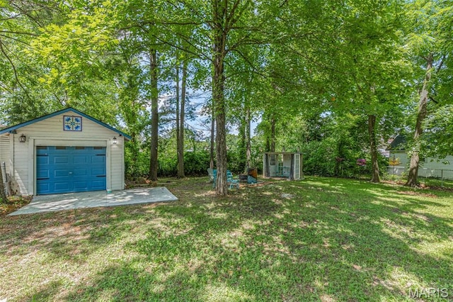 110 Brand Pl, Bonne Terre, MO 63628 - view of grassy yard with an outbuilding and a garage