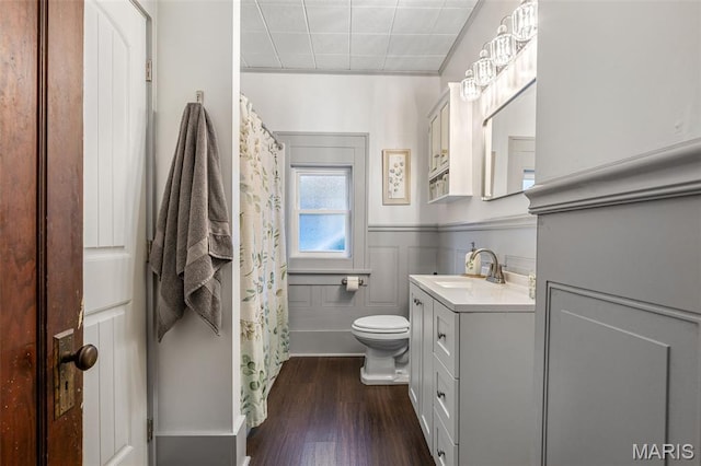 110 Brand Pl, Bonne Terre, MO 63628 - full bath with vanity, wood finished floors, a wainscoted wall, and curtained shower