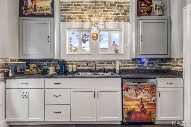 110 Brand Pl, Bonne Terre, MO 63628 - bar featuring dishwasher, tasteful backsplash, and hanging light fixtures