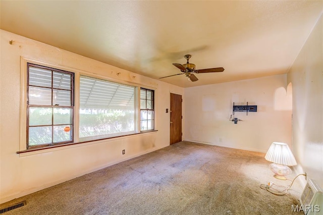8232 Davenport Dr, Berkeley, MO 63134 - carpeted empty room with a ceiling fan and baseboards