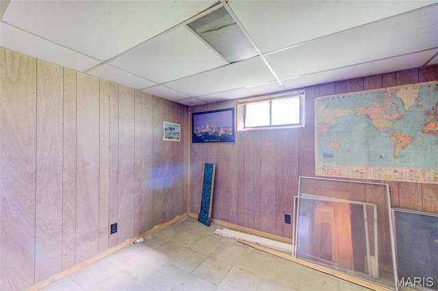8232 Davenport Dr, Berkeley, MO 63134 - below grade area featuring wooden walls and tile patterned floors
