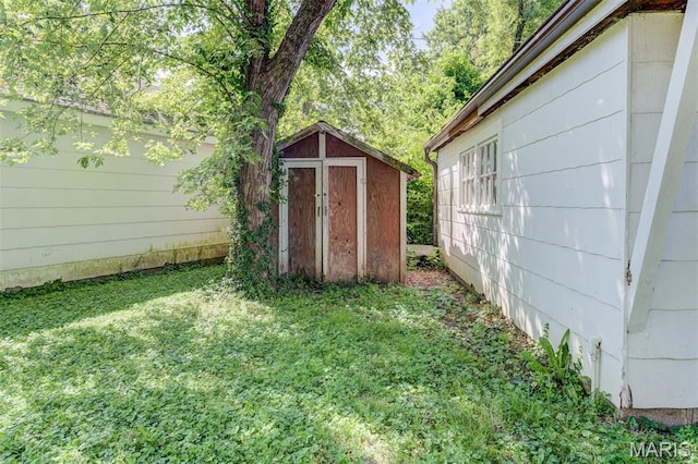 8232 Davenport Dr, Berkeley, MO 63134 - view of grassy yard with a storage unit