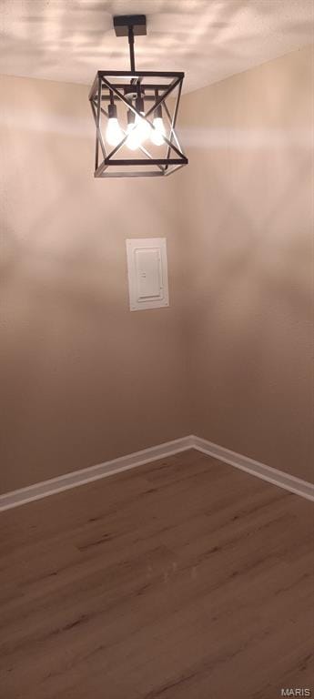 720 Southwell Ln, Florissant, MO 63031 - detailed view of wood finished floors and a chandelier