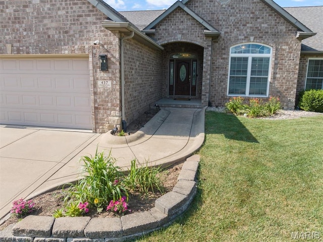 437 Marbleton Cir, Ofallon, IL 62269 - view of front facade featuring a front yard, a garage, brick siding, concrete driveway, and a shingled roof