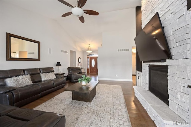 437 Marbleton Cir, Ofallon, IL 62269 - living room with ceiling fan, dark wood finished floors, a stone fireplace, and high vaulted ceiling