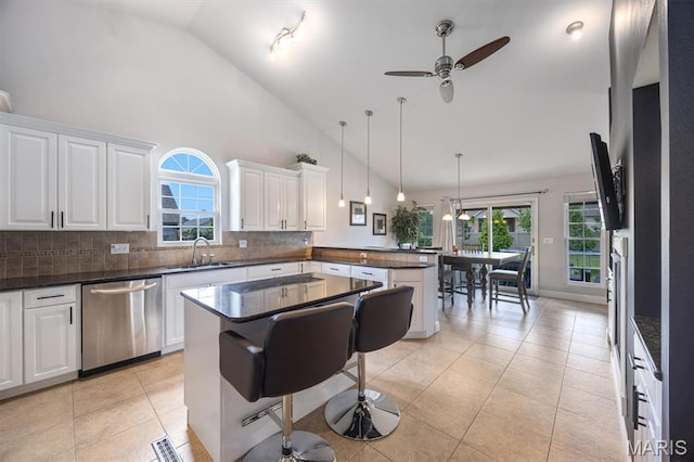 437 Marbleton Cir, Ofallon, IL 62269 - kitchen featuring stainless steel dishwasher, a peninsula, a ceiling fan, white cabinets, and backsplash