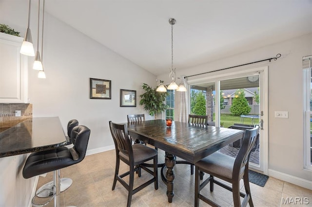 437 Marbleton Cir, Ofallon, IL 62269 - dining space featuring vaulted ceiling, a chandelier, and light tile patterned flooring