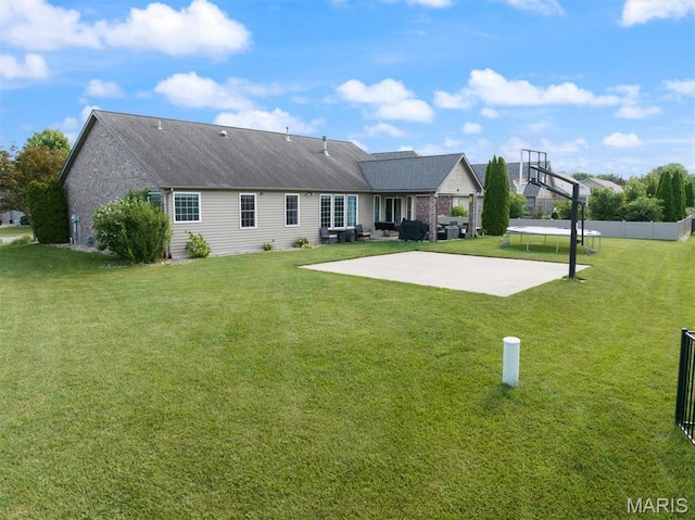 437 Marbleton Cir, Ofallon, IL 62269 - rear view of house featuring a patio area, basketball court, brick siding, and a trampoline