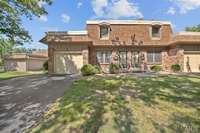2417 Charente Dr, Maryland Heights, MO 63043 - view of front of home featuring brick siding, roof with shingles, driveway, an attached garage, and mansard roof
