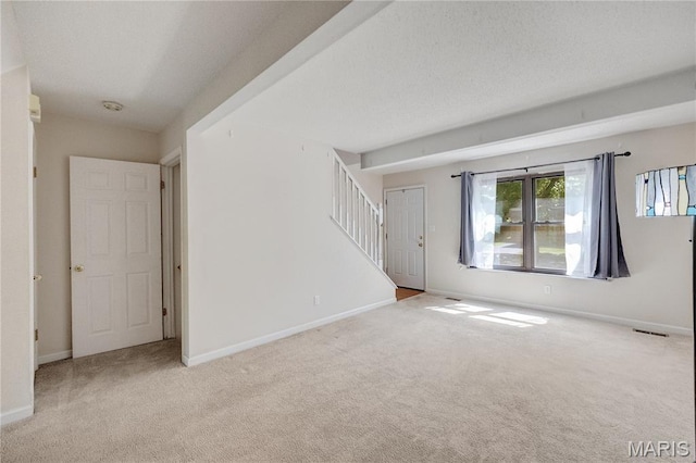 2417 Charente Dr, Maryland Heights, MO 63043 - spare room featuring carpet flooring, stairway, and a smoke detector