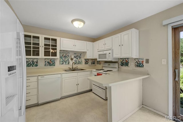 2417 Charente Dr, Maryland Heights, MO 63043 - kitchen featuring white appliances, a peninsula, light countertops, and white cabinets
