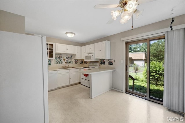 2417 Charente Dr, Maryland Heights, MO 63043 - kitchen with white appliances, light countertops, white cabinetry, and ceiling fan