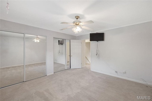 2417 Charente Dr, Maryland Heights, MO 63043 - unfurnished bedroom featuring carpet, multiple closets, ornamental molding, and a ceiling fan